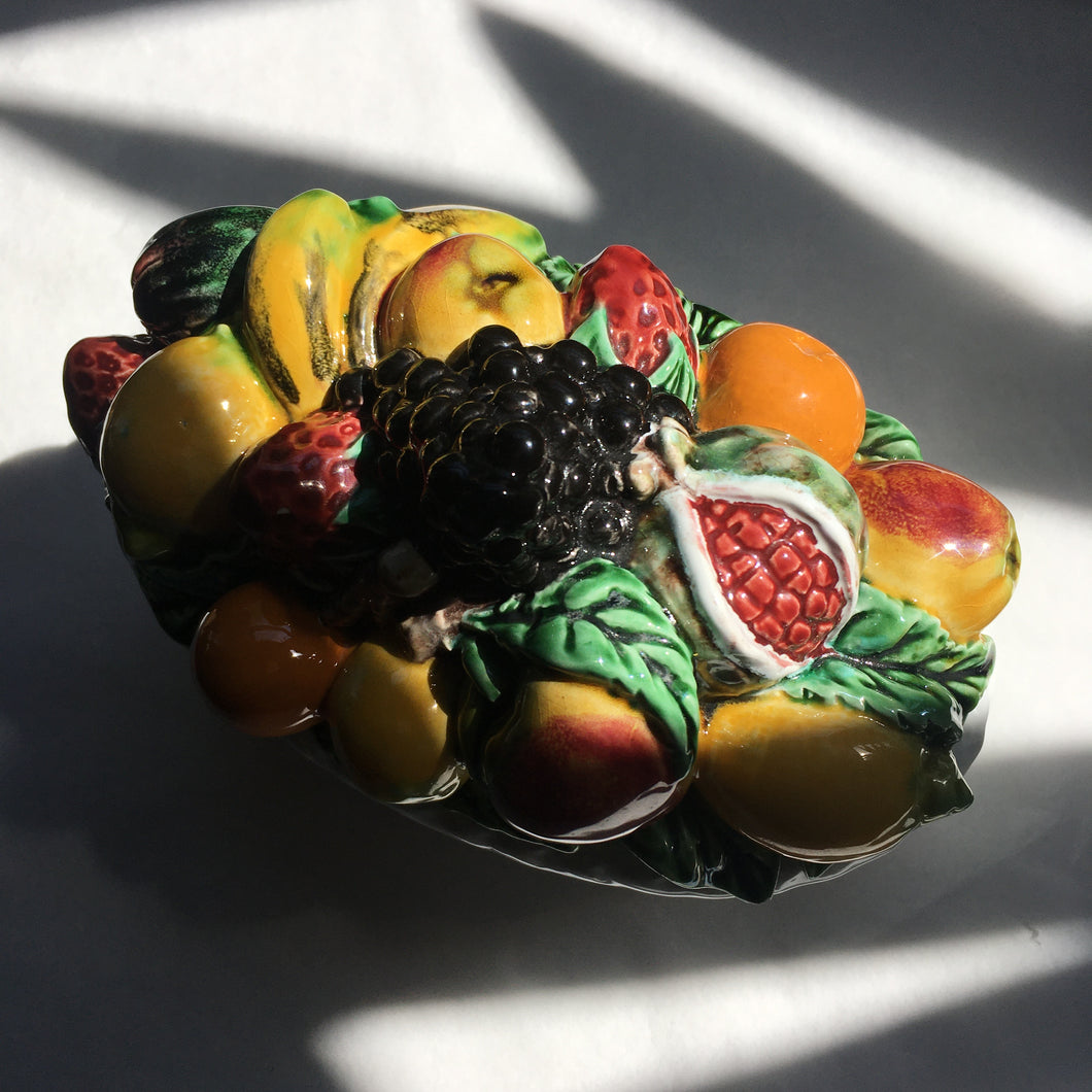 Fruit topped ceramic basket work dish